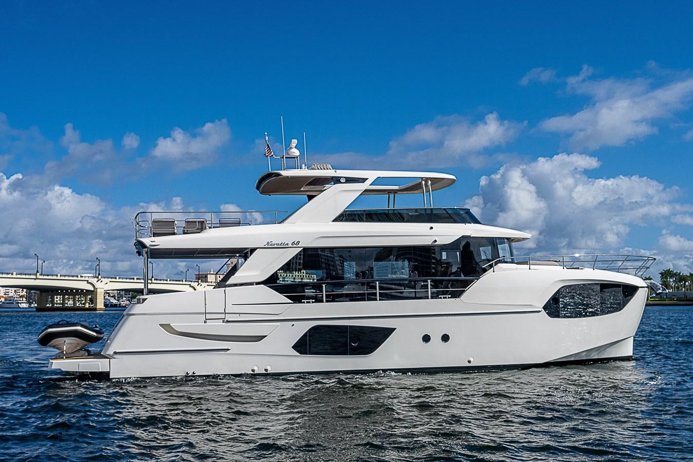 a white yacht on the water aboard 68 NAVETTA  Yacht for Sale