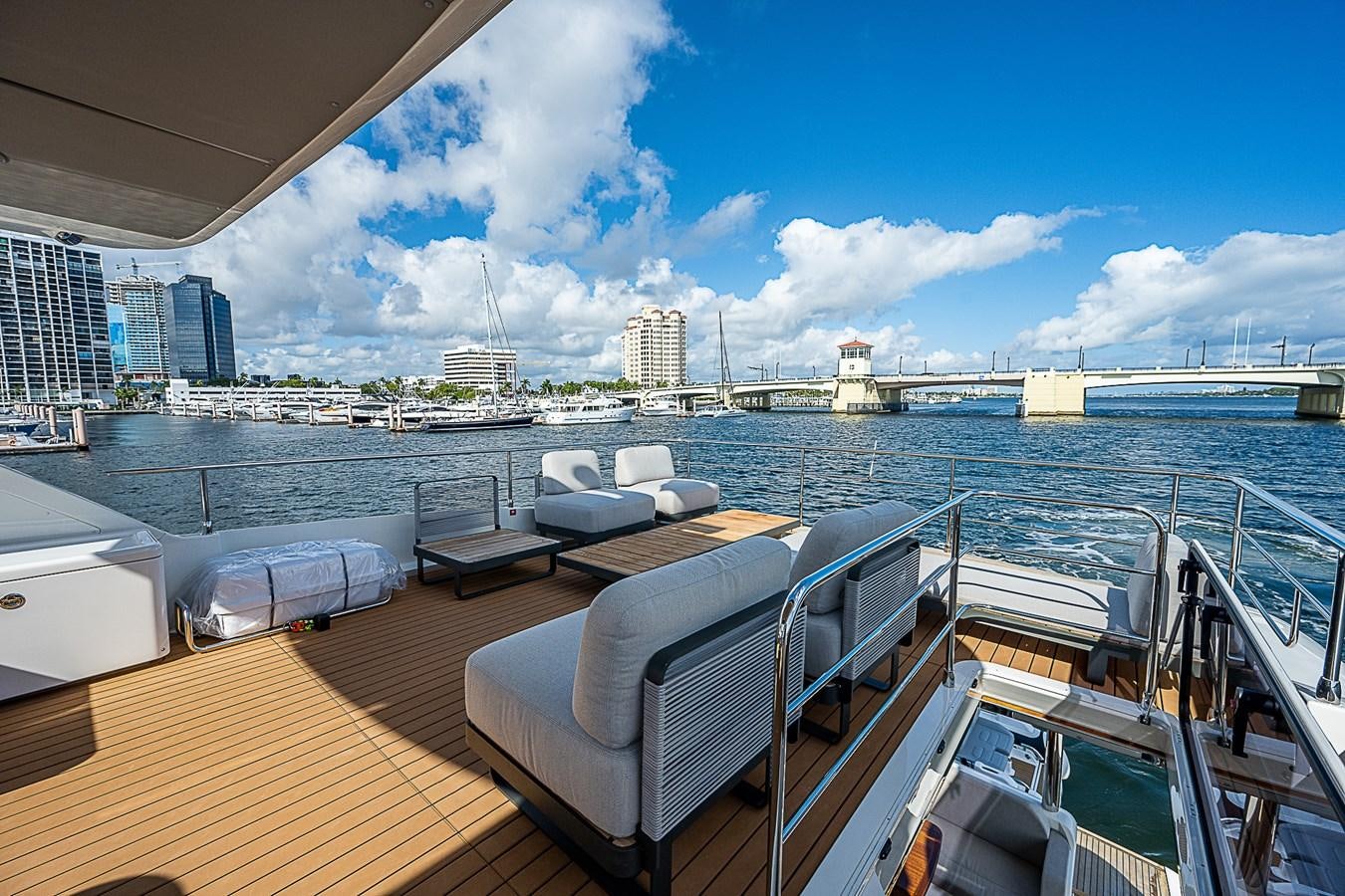 a deck with a view of a city and water aboard 68 NAVETTA  Yacht for Sale