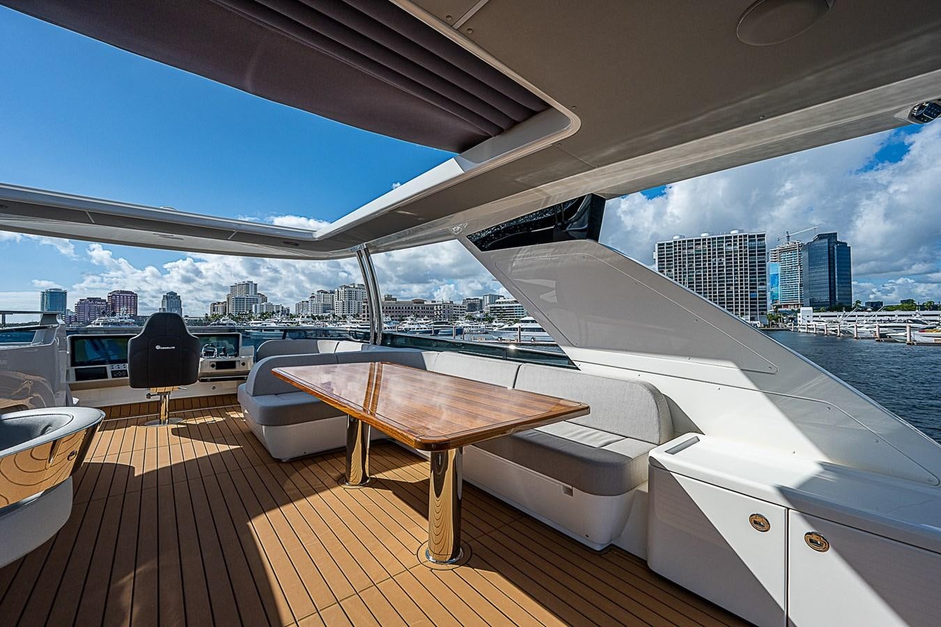 a room with a table and a view of a city aboard 68 NAVETTA  Yacht for Sale