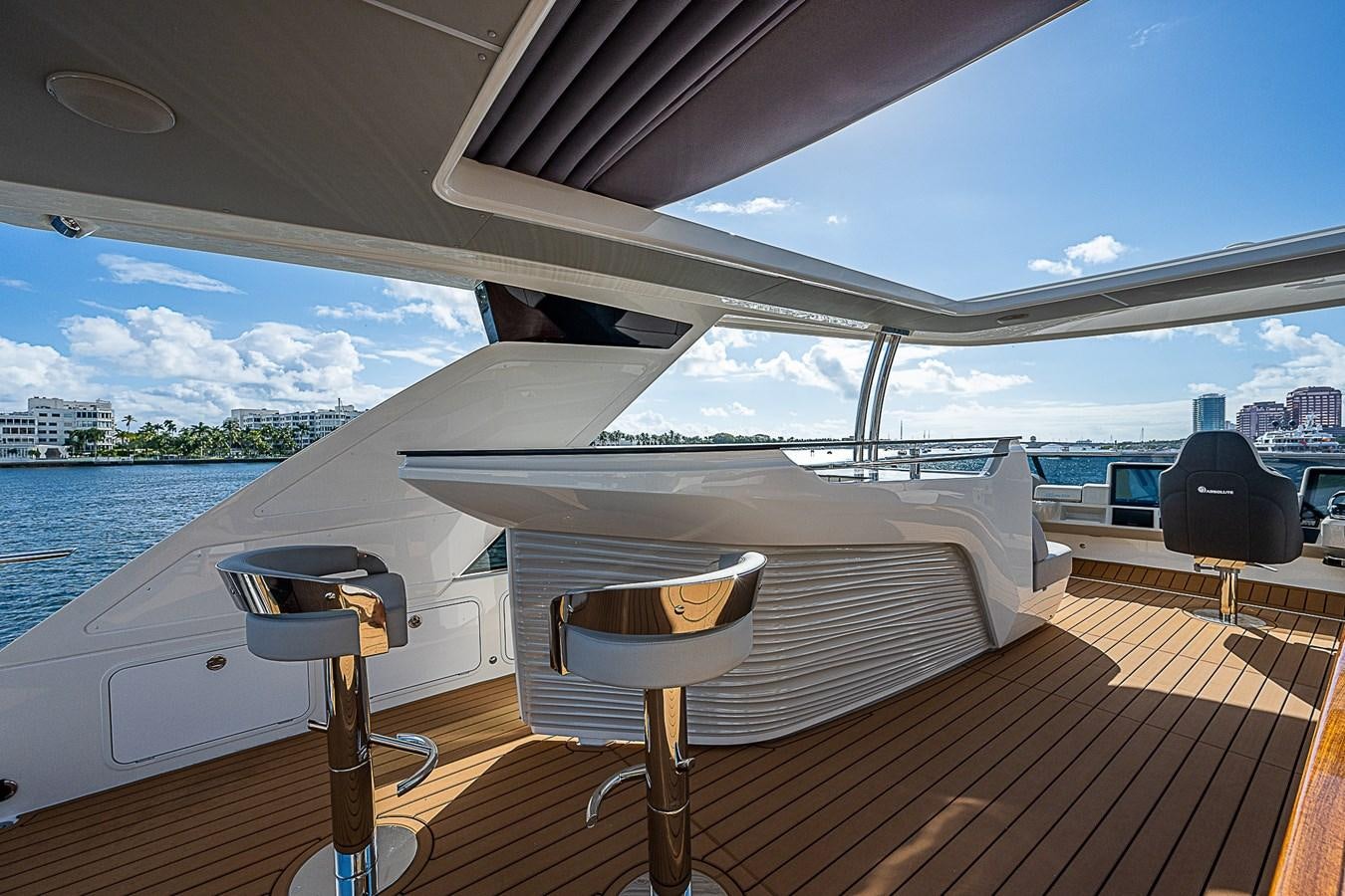 a deck with a piano and a chair on it aboard 68 NAVETTA  Yacht for Sale