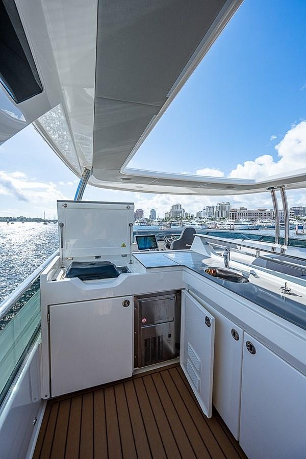 a deck with a large window overlooking a city aboard 68 NAVETTA  Yacht for Sale