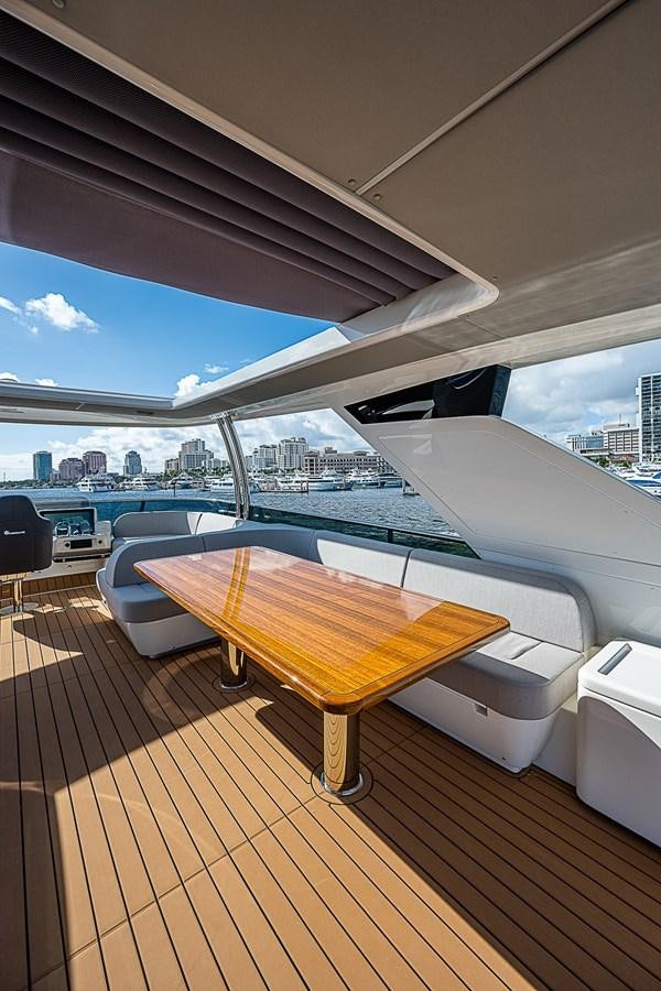 a wooden table on a deck aboard 68 NAVETTA  Yacht for Sale