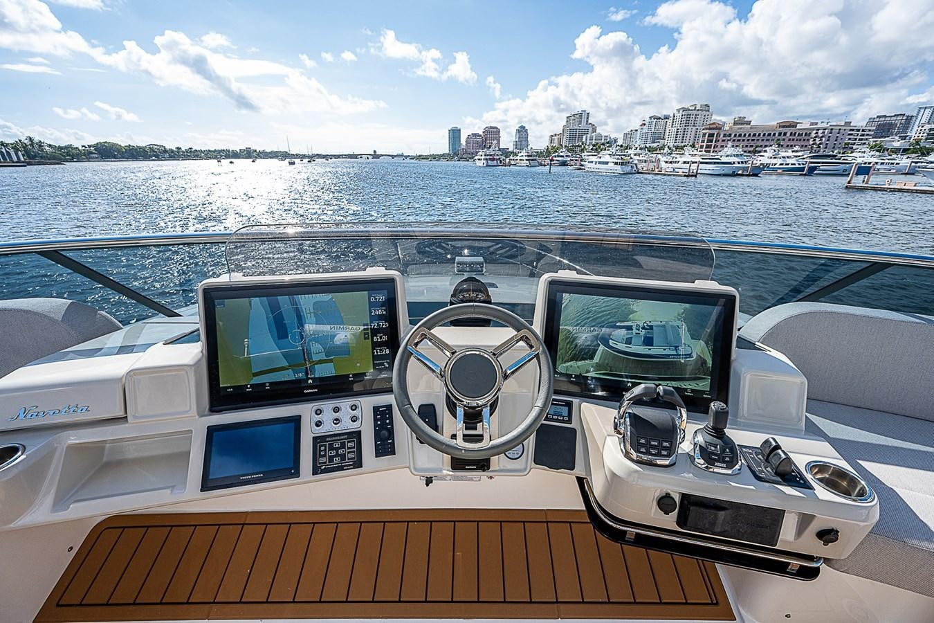 a boat with a view of a city and water below aboard 68 NAVETTA  Yacht for Sale