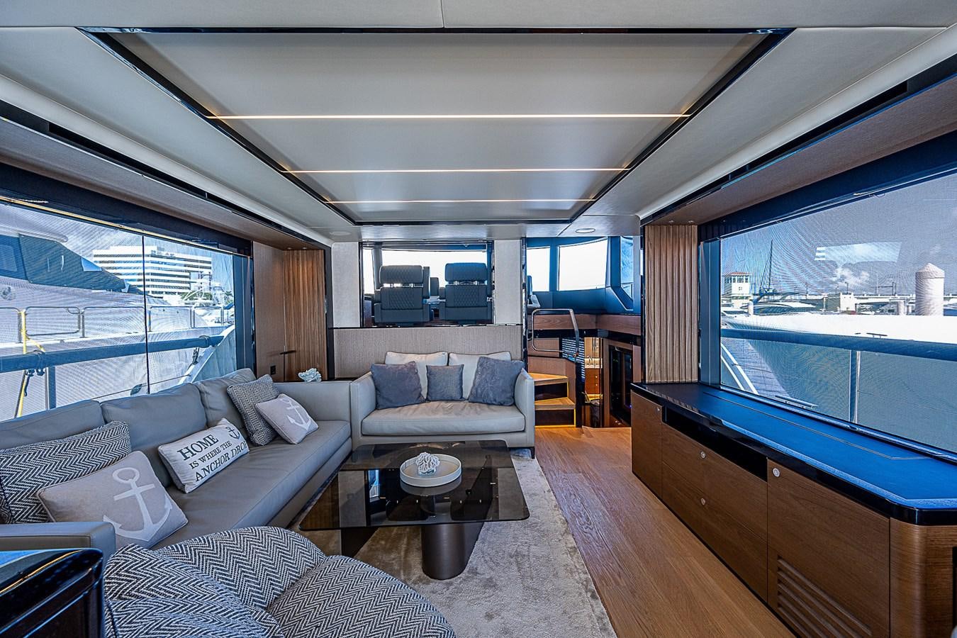 a living room with a large window aboard 68 NAVETTA  Yacht for Sale