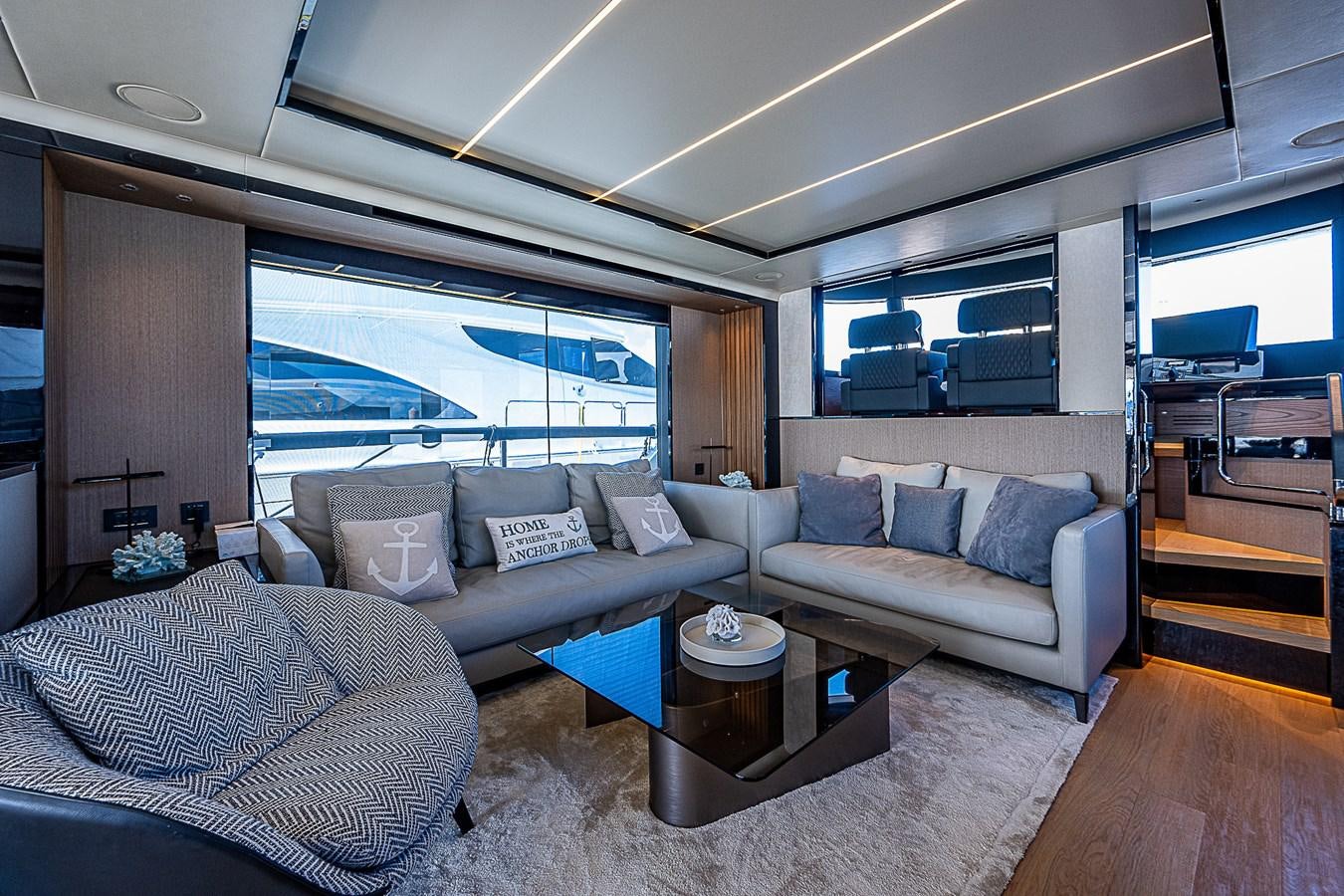 a living room with a couch and a coffee table aboard 68 NAVETTA  Yacht for Sale
