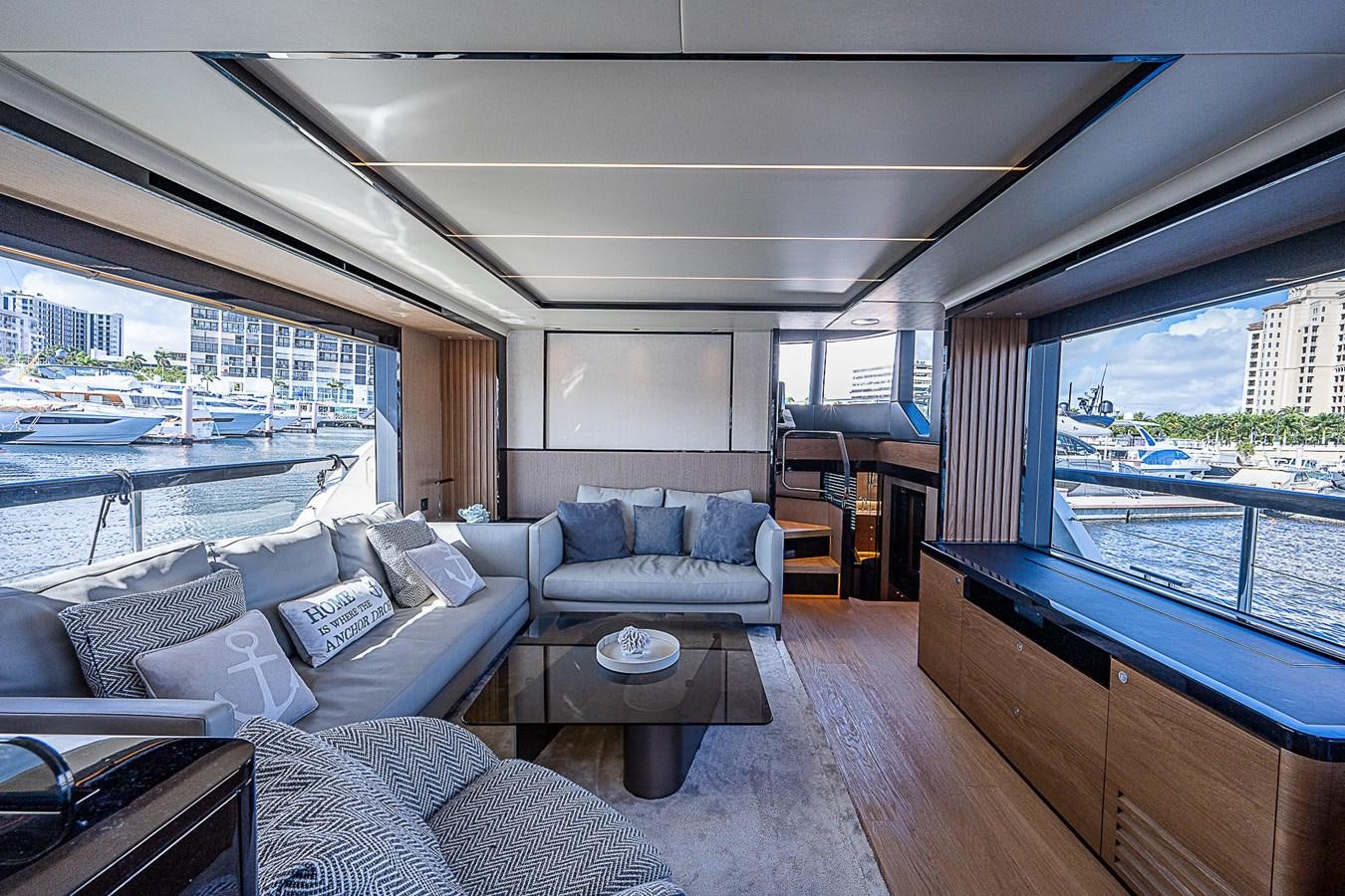 a living room with a large window aboard 68 NAVETTA  Yacht for Sale