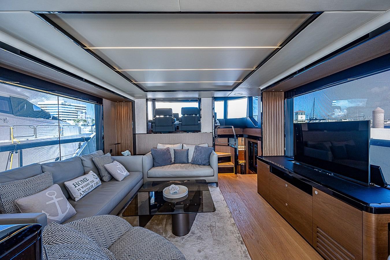 a living room with a large television aboard 68 NAVETTA  Yacht for Sale