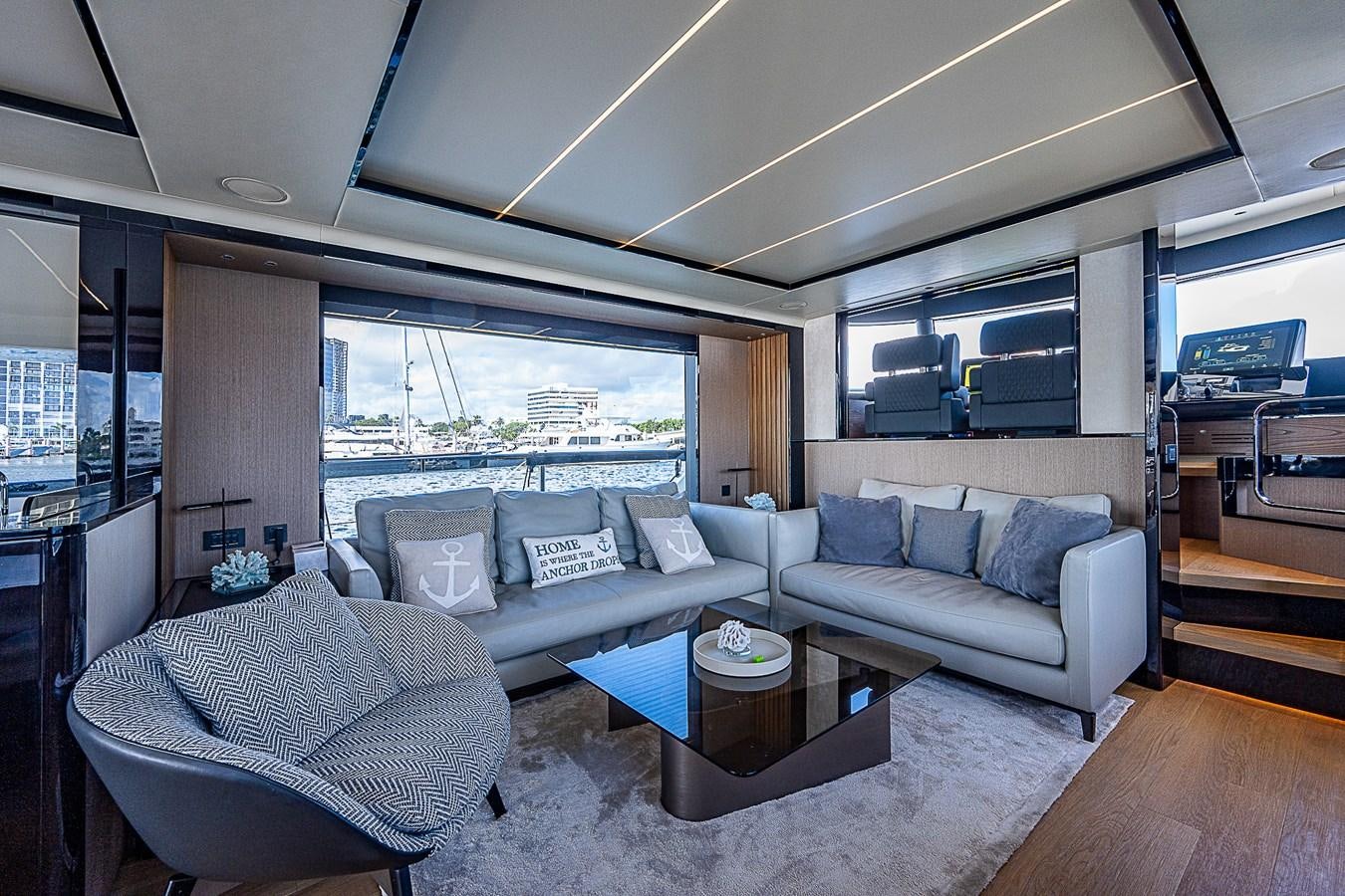 a living room with a couch and a table aboard 68 NAVETTA  Yacht for Sale