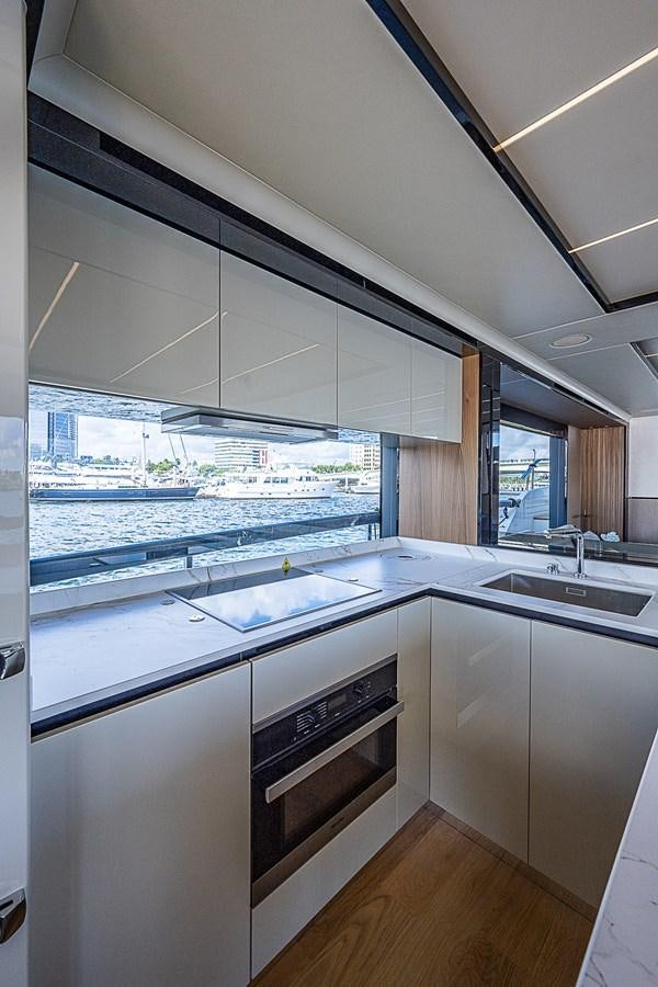 a kitchen with a view of the city aboard 68 NAVETTA  Yacht for Sale