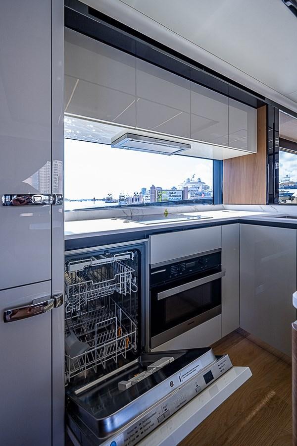 a kitchen with a large window aboard 68 NAVETTA  Yacht for Sale