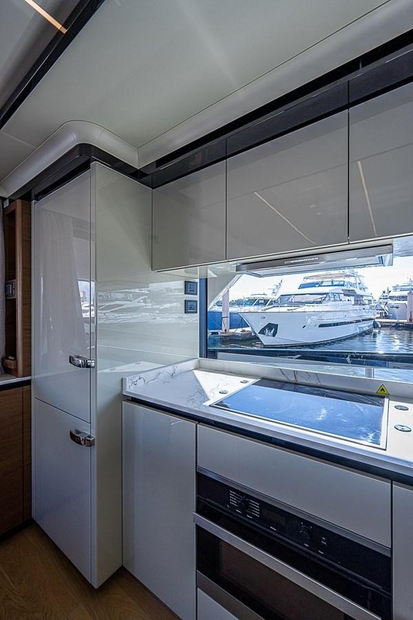 a kitchen with a glass wall aboard 68 NAVETTA  Yacht for Sale