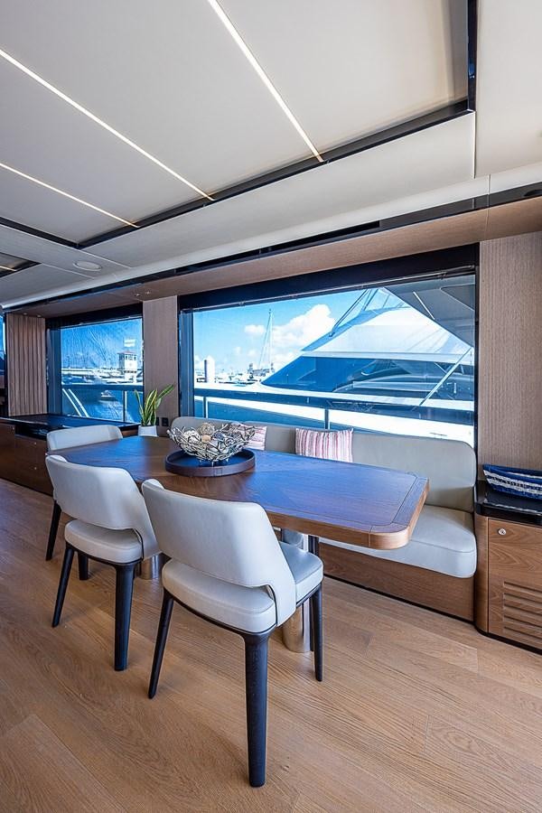 a room with a table and chairs aboard 68 NAVETTA  Yacht for Sale