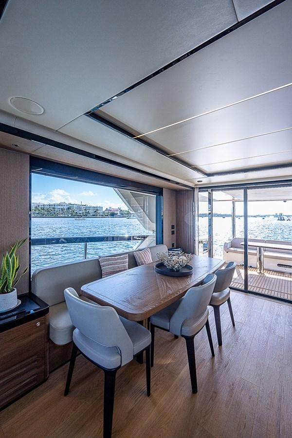 a room with a table and chairs aboard 68 NAVETTA  Yacht for Sale