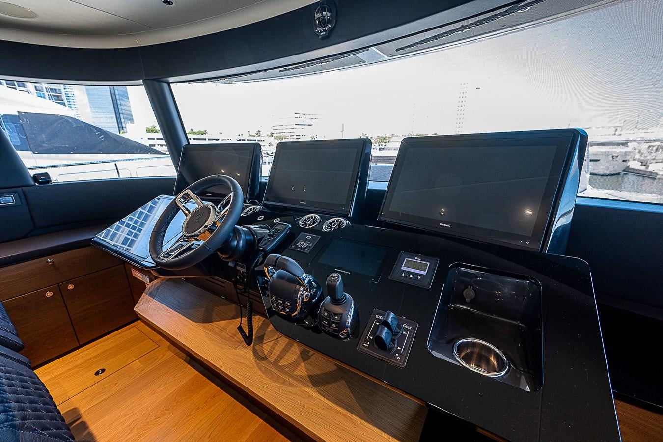 a car with a laptop and a headset on it aboard 68 NAVETTA  Yacht for Sale