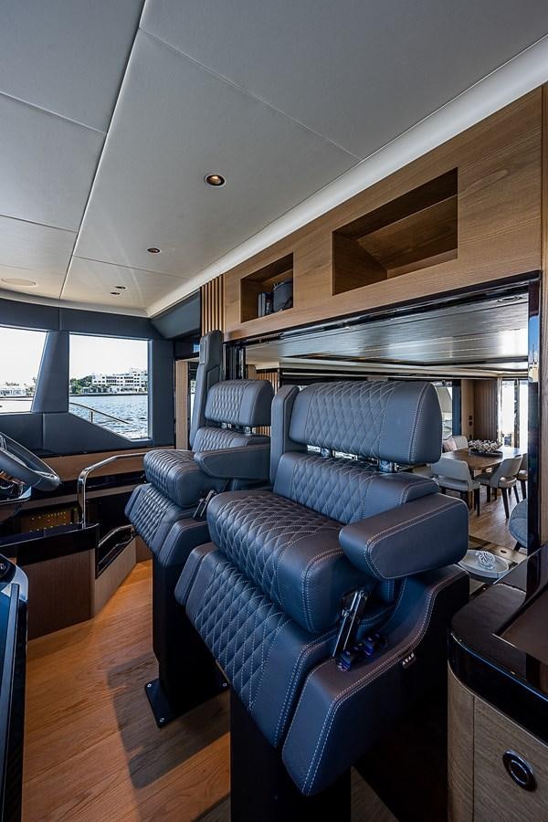 a room with a couch and a table aboard 68 NAVETTA  Yacht for Sale