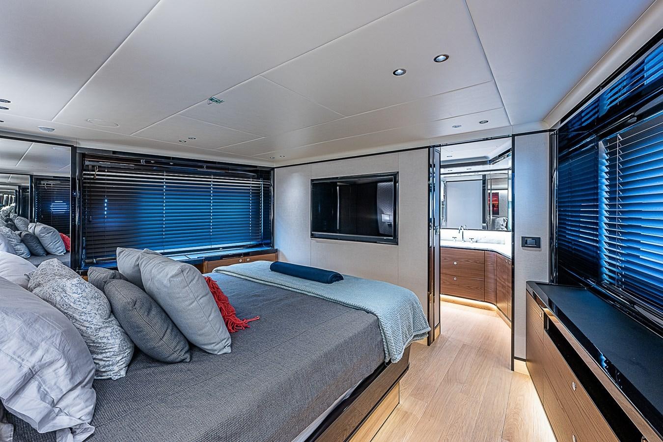 a bedroom with a bed and a tv aboard 68 NAVETTA  Yacht for Sale