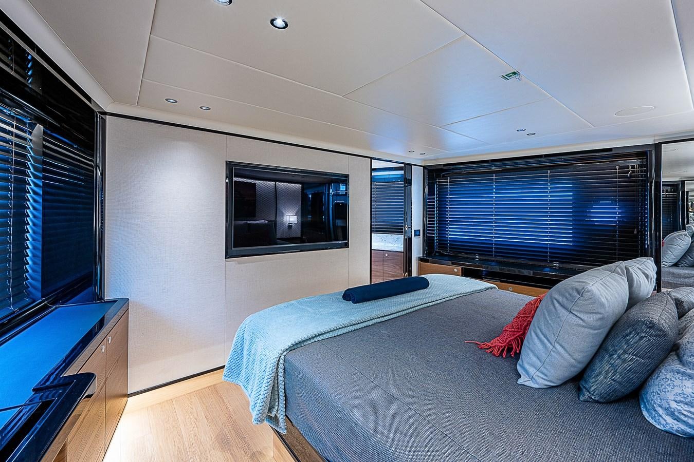 a bedroom with a bed and a tv aboard 68 NAVETTA  Yacht for Sale