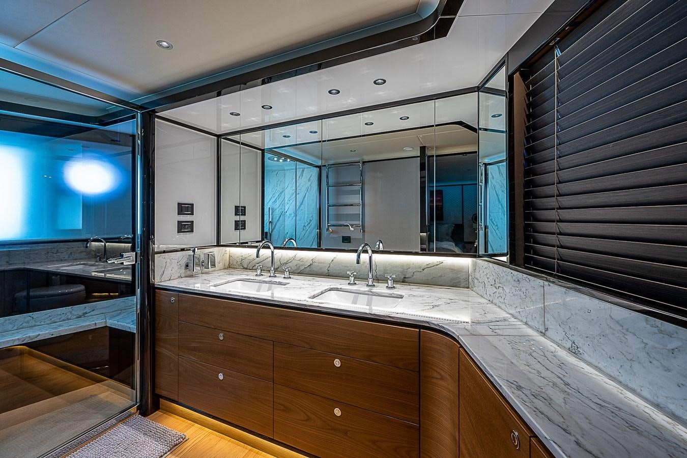 a bathroom with a large mirror aboard 68 NAVETTA  Yacht for Sale