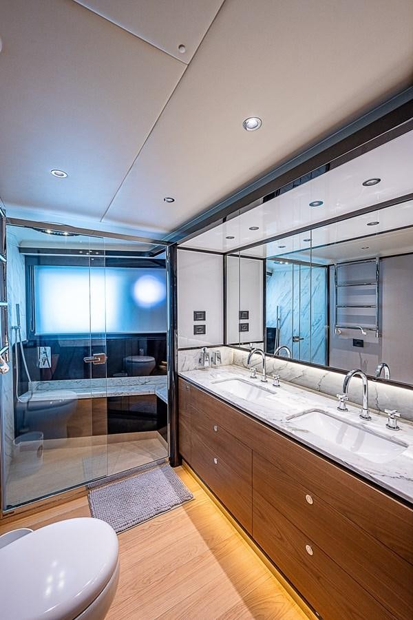 a bathroom with a large mirror aboard 68 NAVETTA  Yacht for Sale