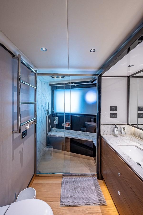 a bathroom with a large glass shower aboard 68 NAVETTA  Yacht for Sale