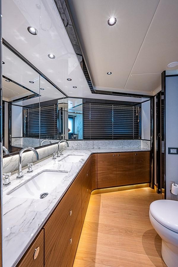 a bathroom with a sink and a toilet aboard 68 NAVETTA  Yacht for Sale