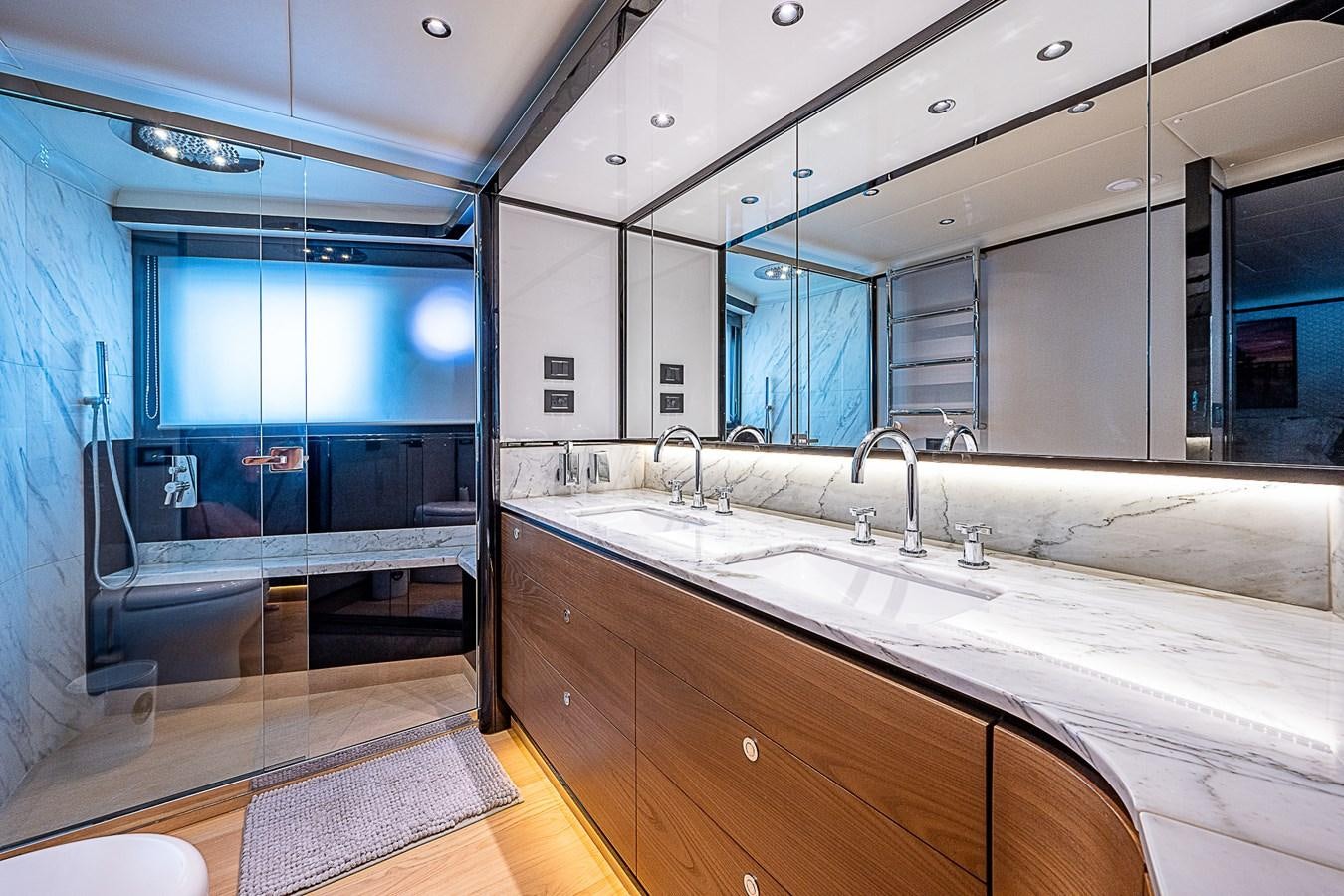 a bathroom with a large mirror aboard 68 NAVETTA  Yacht for Sale