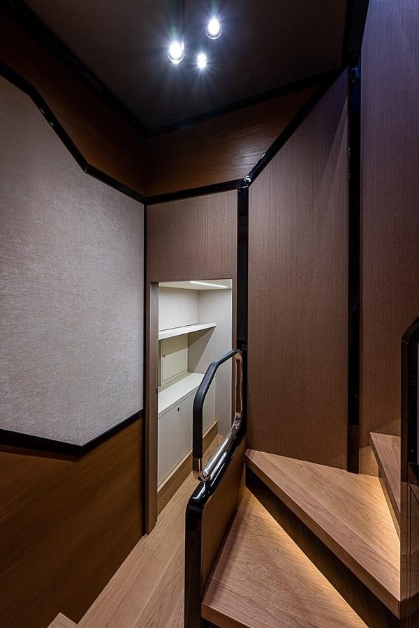 a room with a wood floor and a shelf with a bookcase aboard 68 NAVETTA  Yacht for Sale