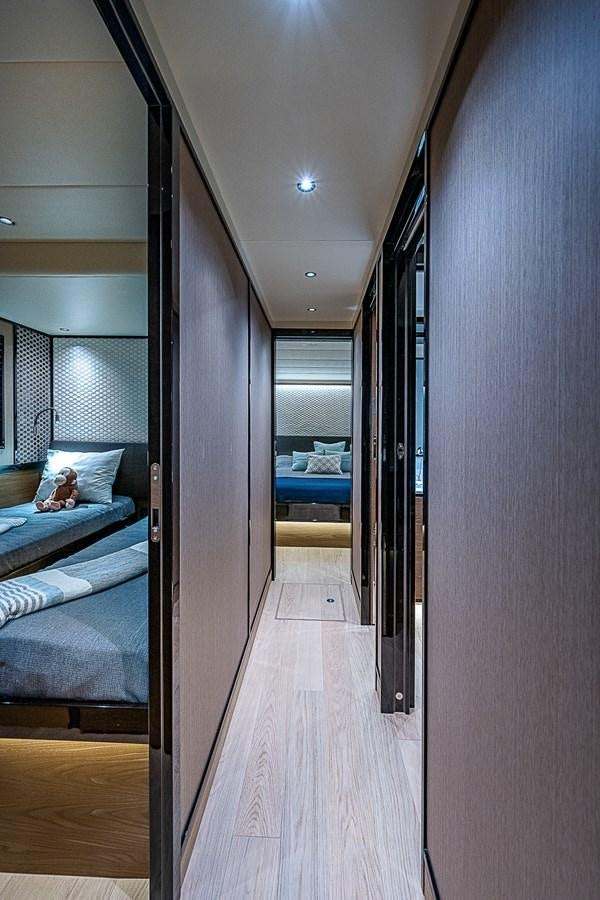 a room with a bed and a door aboard 68 NAVETTA  Yacht for Sale