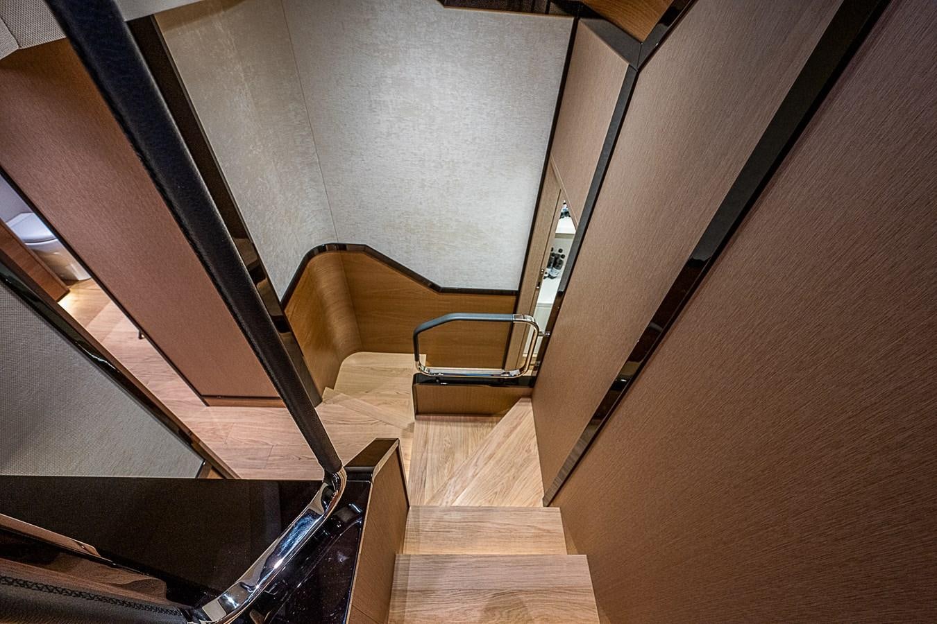 a staircase with a wood floor aboard 68 NAVETTA  Yacht for Sale