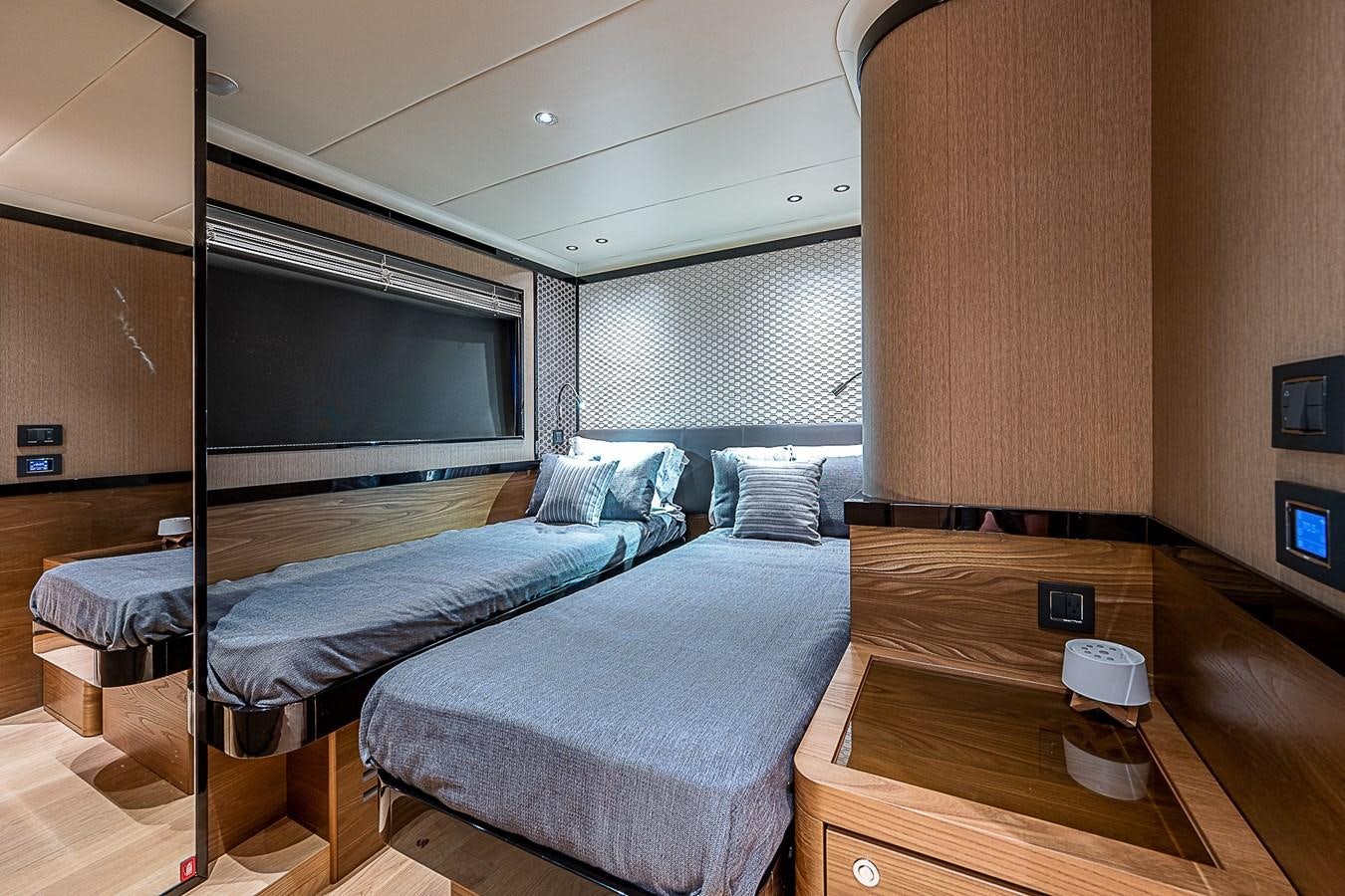 a room with a bed and a table aboard 68 NAVETTA  Yacht for Sale