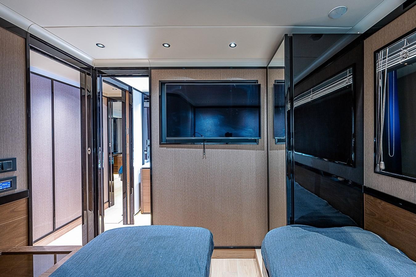 a room with a bed and a television aboard 68 NAVETTA  Yacht for Sale