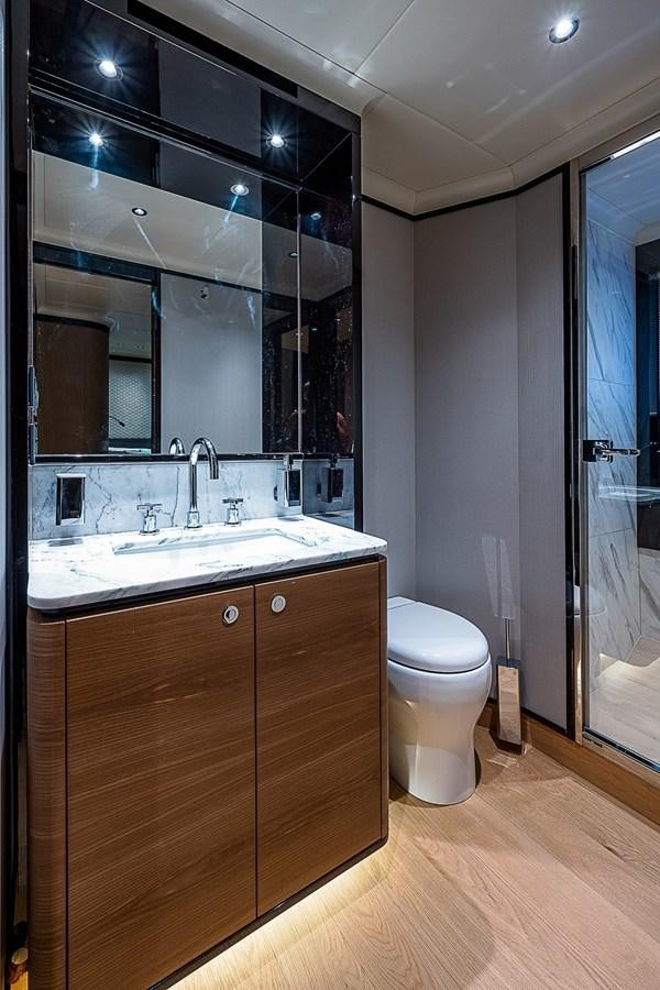 a bathroom with a sink and a toilet aboard 68 NAVETTA  Yacht for Sale