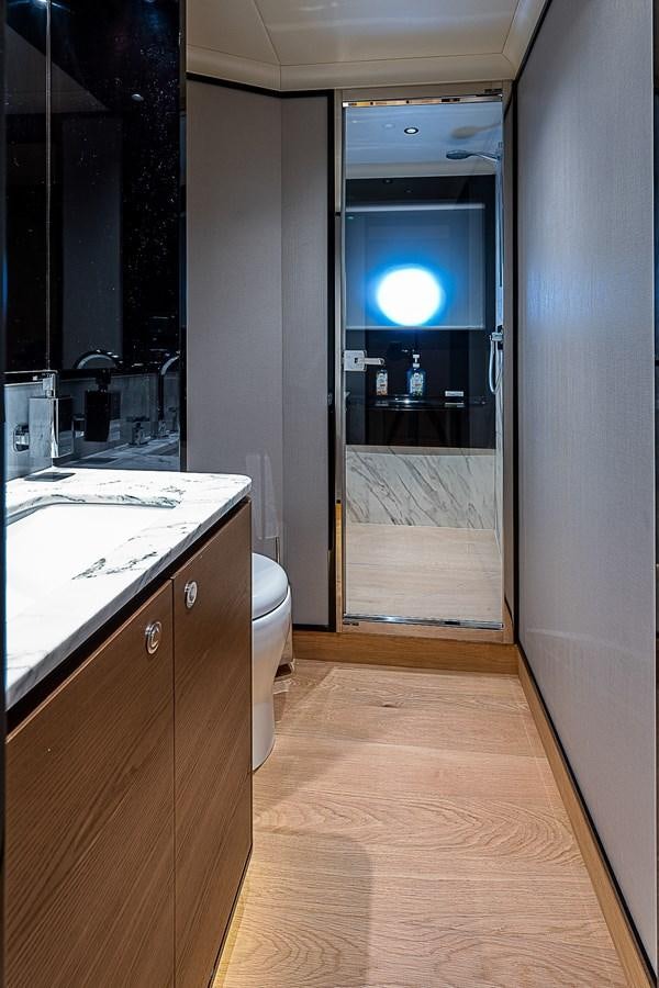 a bathroom with a glass door aboard 68 NAVETTA  Yacht for Sale