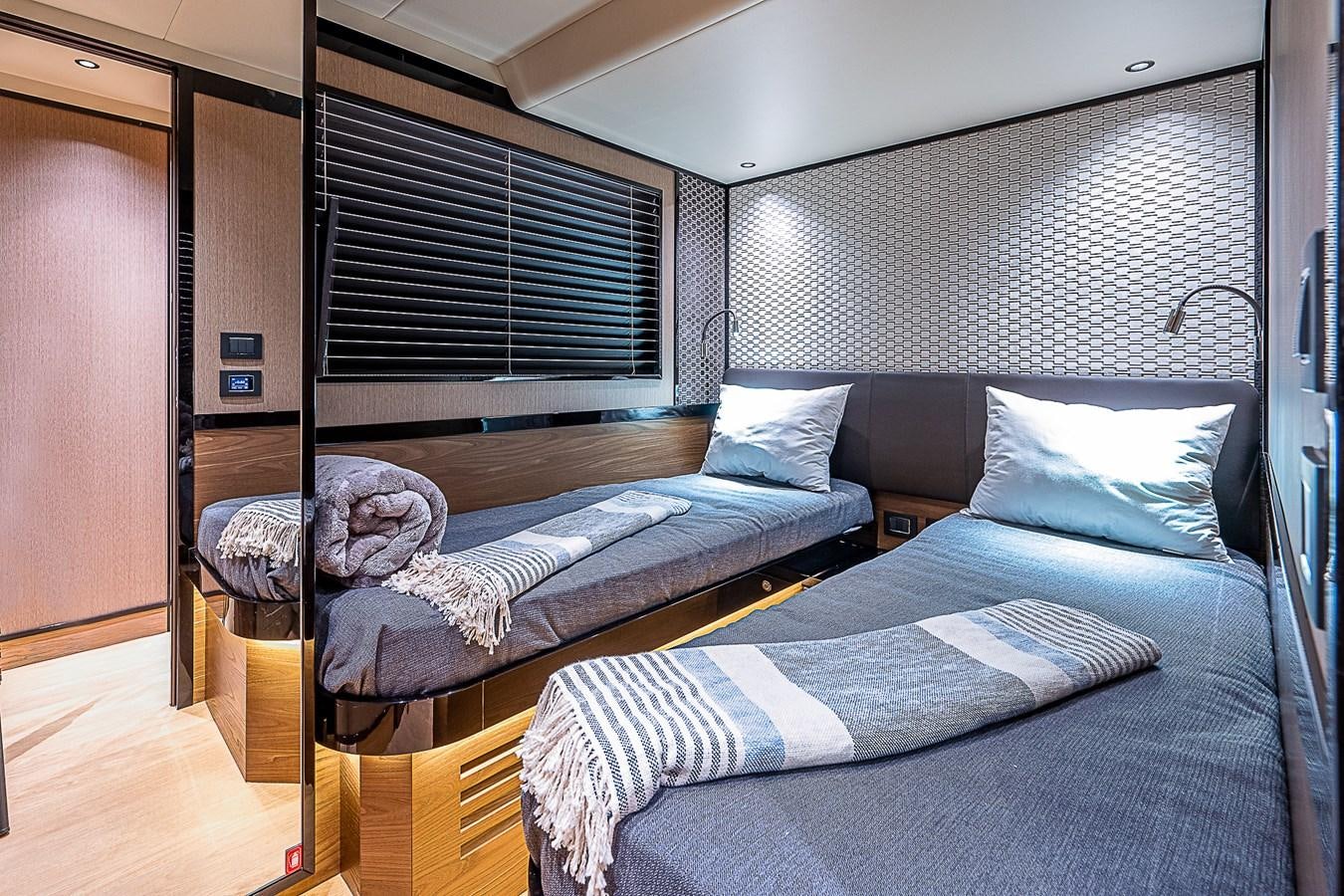 a bed with a blue blanket aboard 68 NAVETTA  Yacht for Sale