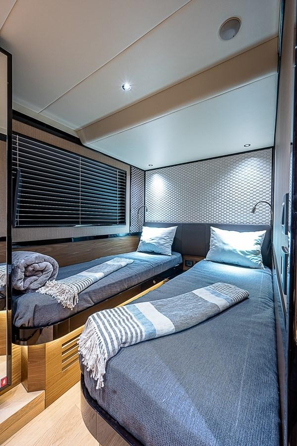 a room with a bed and a window aboard 68 NAVETTA  Yacht for Sale