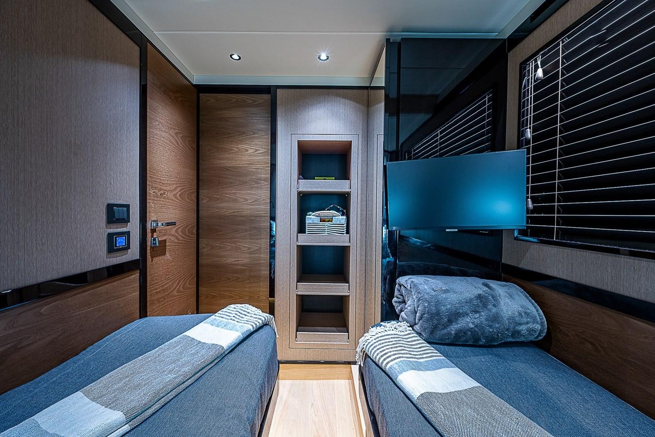 a room with a bed and a tv aboard 68 NAVETTA  Yacht for Sale