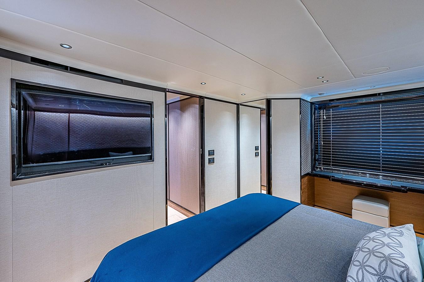 a bedroom with a bed and a tv aboard 68 NAVETTA  Yacht for Sale