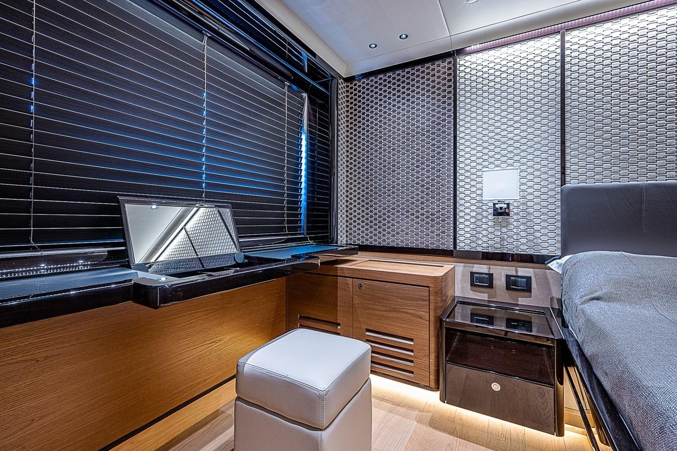 a room with a bed and a desk aboard 68 NAVETTA  Yacht for Sale