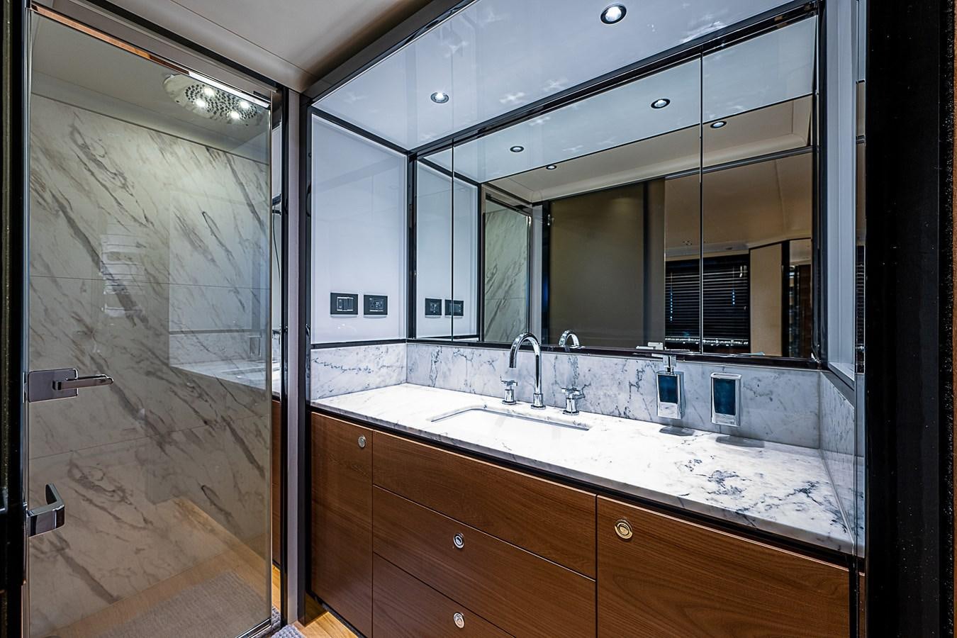 a bathroom with a large mirror aboard 68 NAVETTA  Yacht for Sale