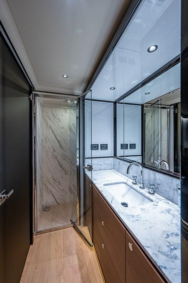 a bathroom with a shower and sink aboard 68 NAVETTA  Yacht for Sale