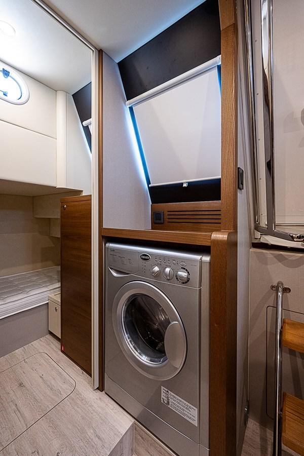 a washer and dryer in a room aboard 68 NAVETTA  Yacht for Sale