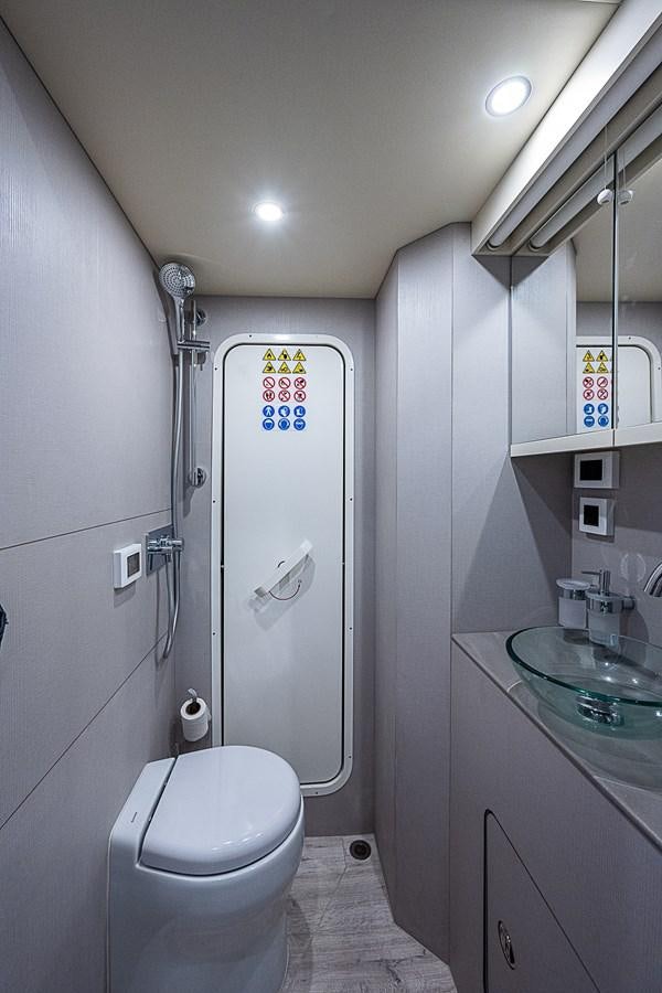 a bathroom with a shower and toilet aboard 68 NAVETTA  Yacht for Sale