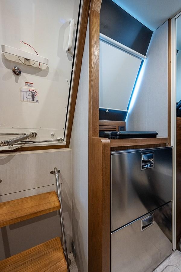 a small refrigerator in a small kitchen aboard 68 NAVETTA  Yacht for Sale