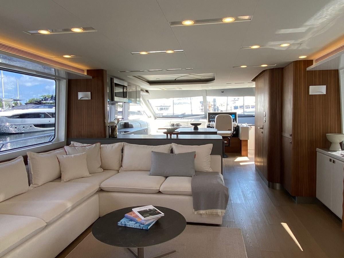 a living room with a large window aboard CLB72 Yacht for Sale