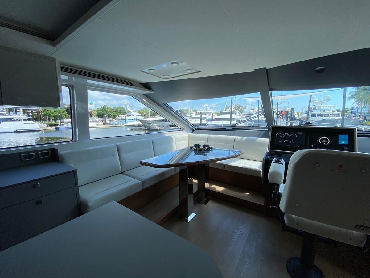 inside of a vehicle with a desk and a large window aboard CLB72 Yacht for Sale