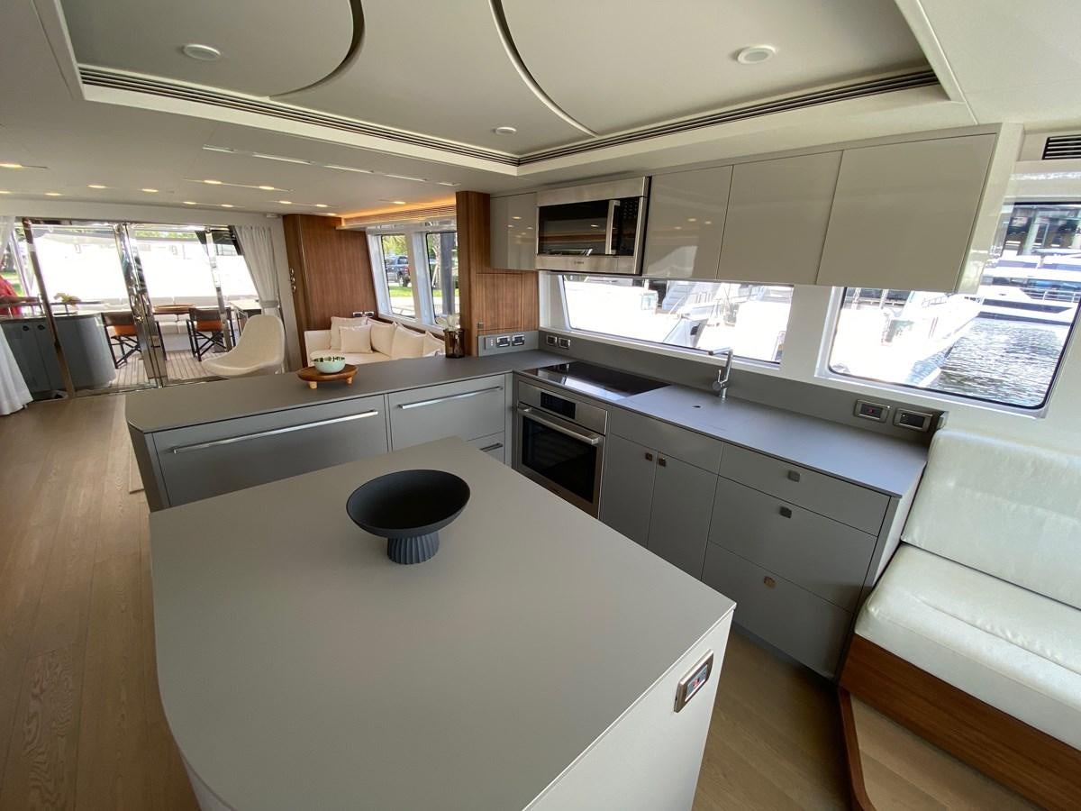 a kitchen with a large island aboard CLB72 Yacht for Sale