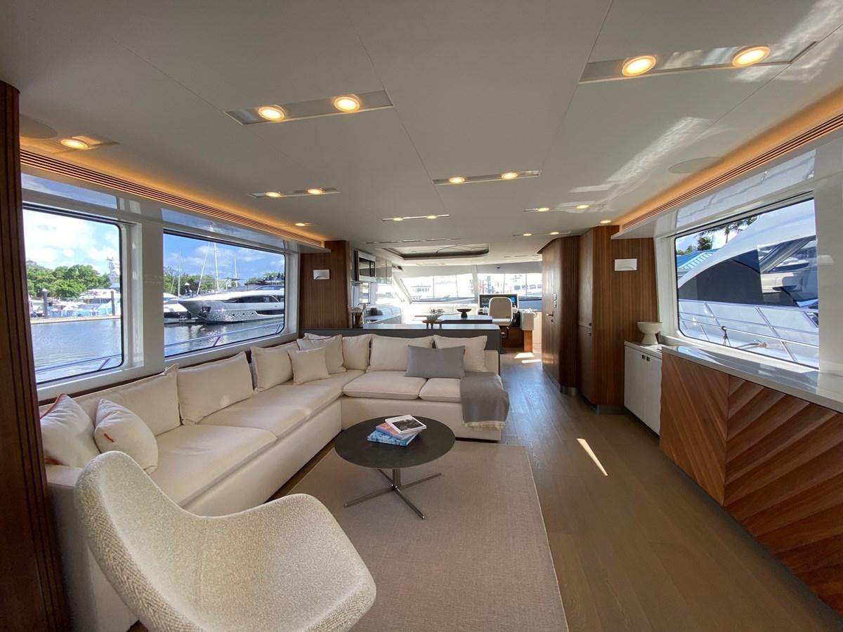 a living room with a large window aboard CLB72 Yacht for Sale