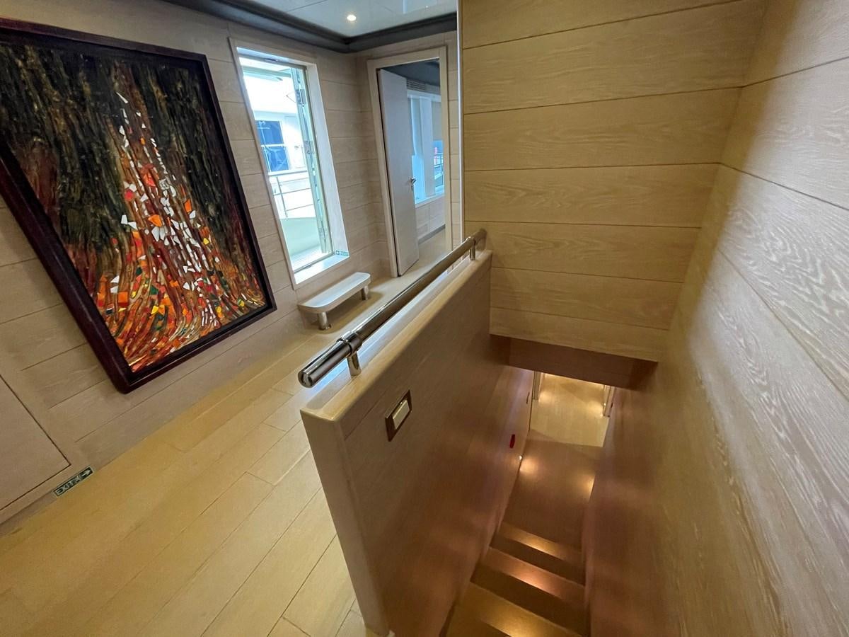 a room with a painting on the wall aboard AQUILA Yacht for Sale