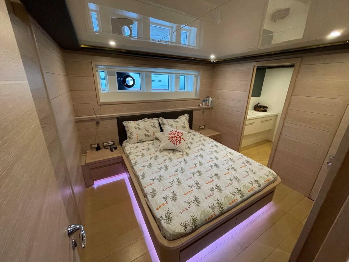 a bed in a room aboard AQUILA Yacht for Sale