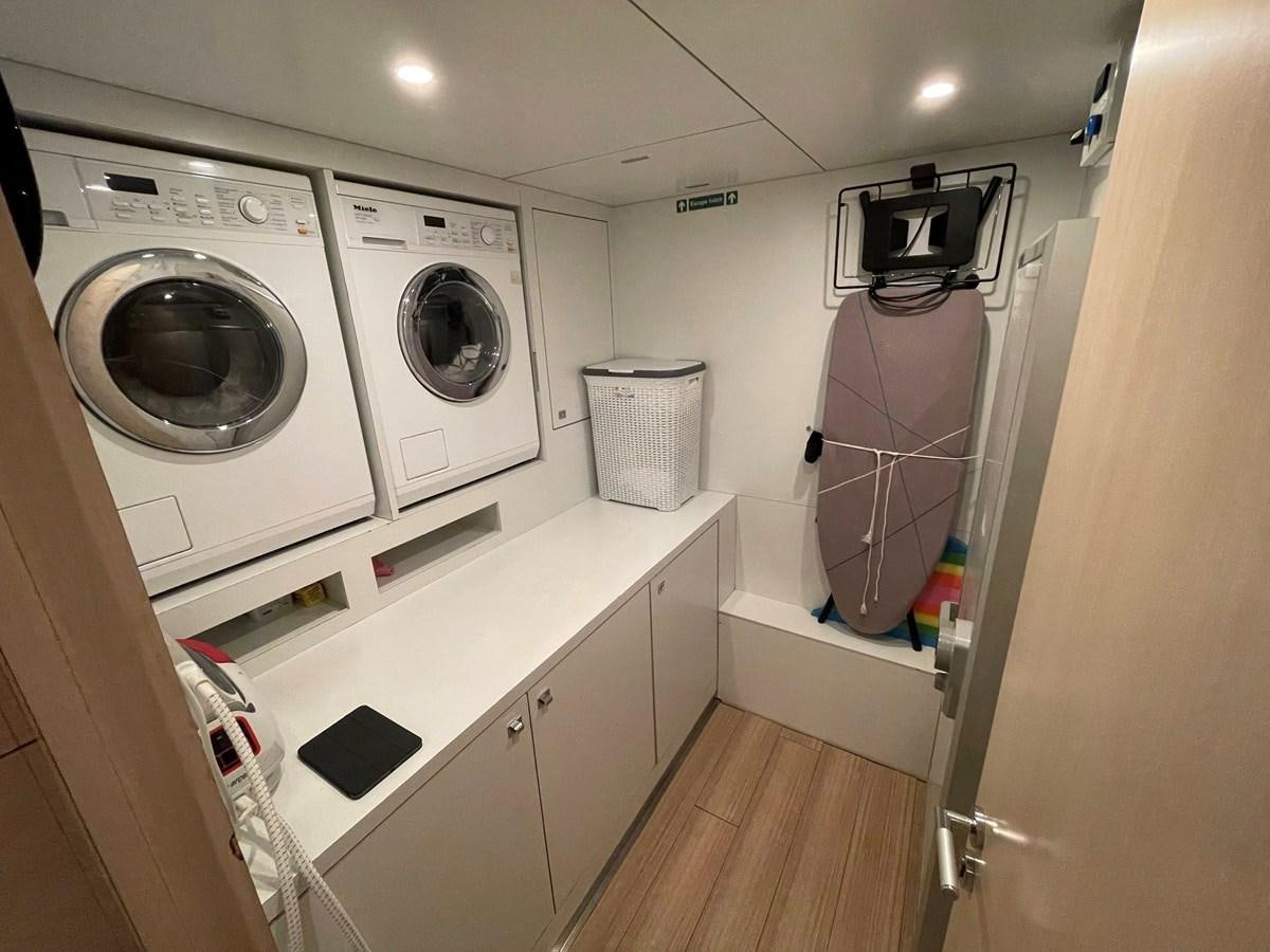 a laundry room with washing machines aboard AQUILA Yacht for Sale